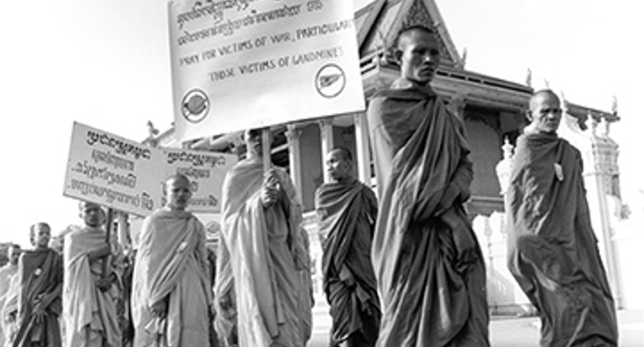 A group of monks on a march advocating for a ban of landmines