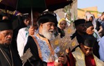 Clergy lead the Epiphany service, dressed in traditional robes