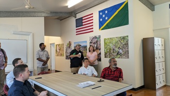 Representative Ami Bera sits with colleagues around a table in a meeting 