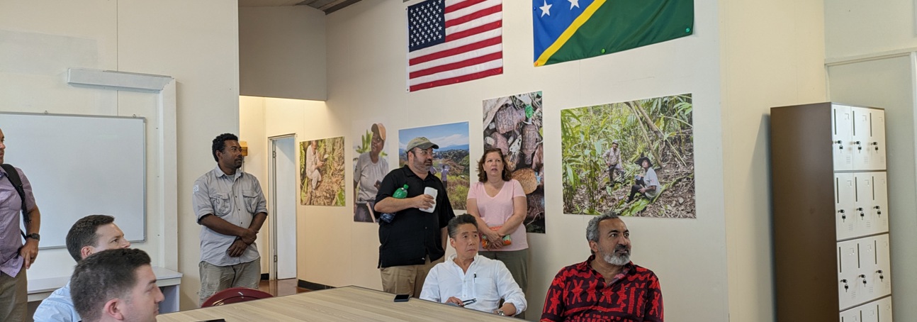 Representative Ami Bera sits with colleagues around a table in a meeting 