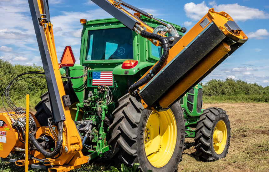 A tractor used for mechanical demining on a field 