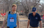Prince Harry and HALO Trust CEO, James Cowan wear PPE and walk through a cleared minefield