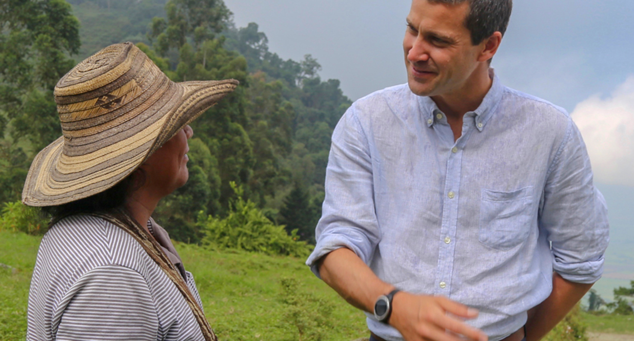 Craig Kowalik talks outside with a local woman from the Kwet Wala Indigenous Reserve