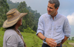 Craig Kowalik talks outside with a local woman from the Kwet Wala Indigenous Reserve