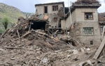 The wreckage of a building partially destroyed by an earthquake.