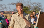Prince Harry smiles during a briefing in Angola