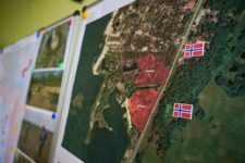 A map of the petriviske region with Norway flags on it