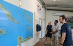 HALO staff members look at a map of the Solomon Islands