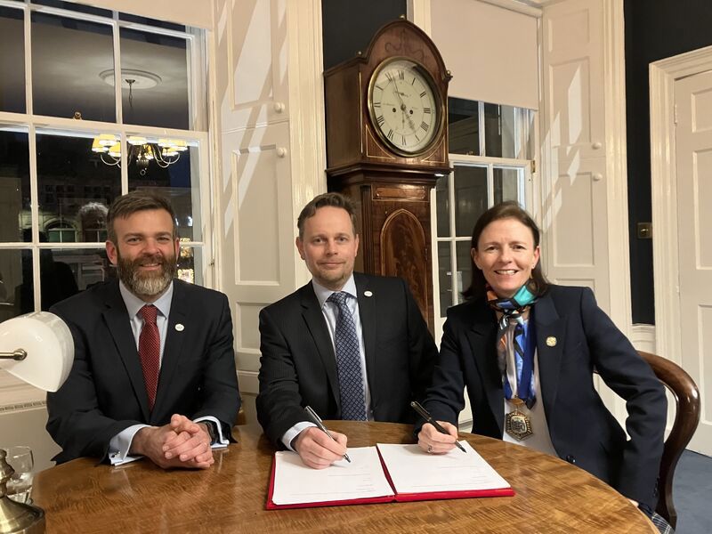 Tim Gargan from HALO signs an agreement with representatives of Royal College of Surgeons Edinburgh