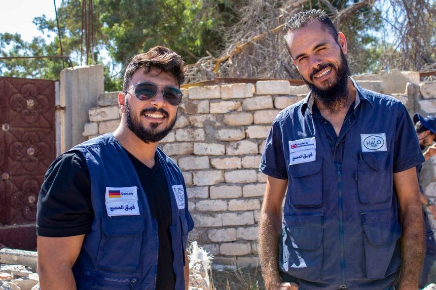 Two members from the survey team pose outside