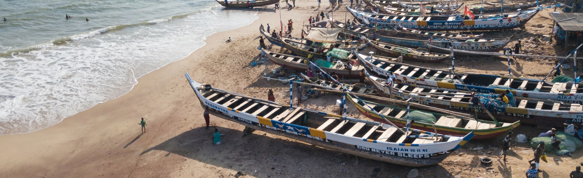 Small wooden boats on the sea in Ghana