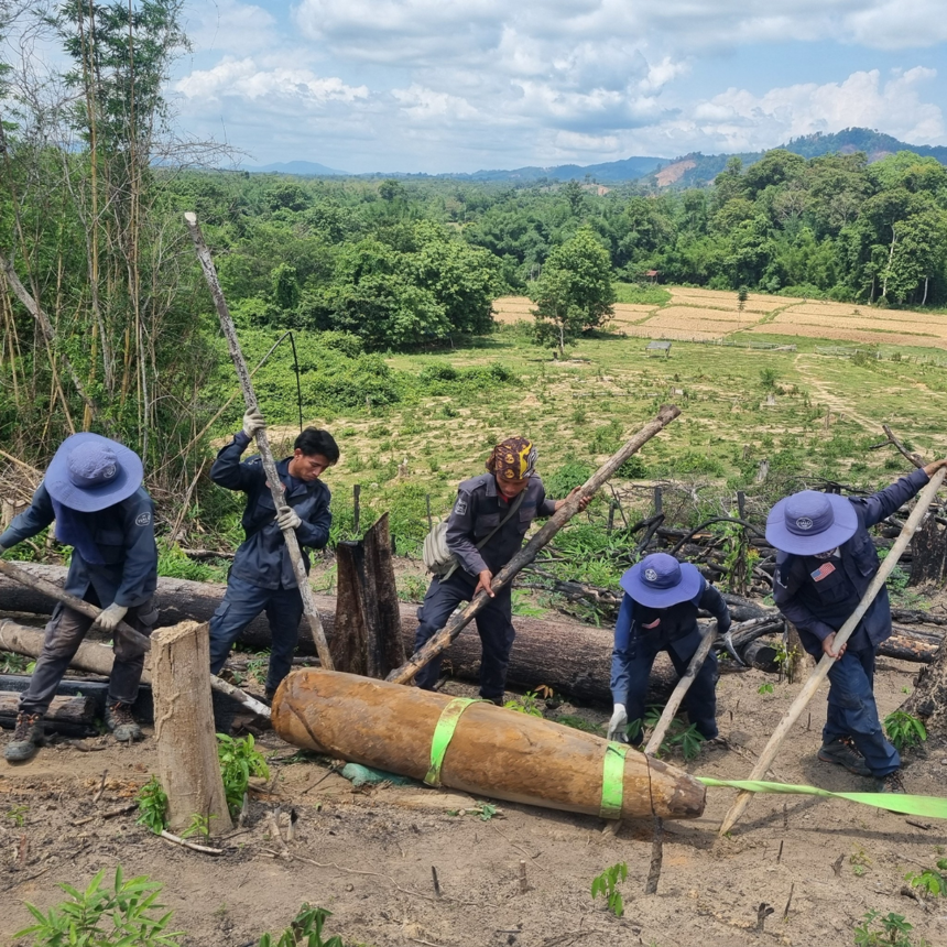HALO Laos team moving a 1,000lb bomb