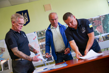 HALO staff members look through papers in an office 