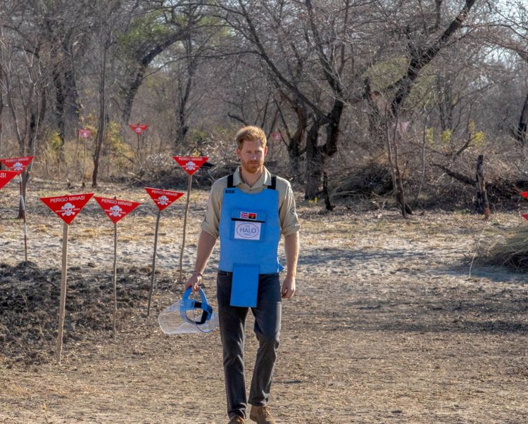 Prince Harry walks through a minefield being cleared by HALO in Dirico, Angola.
