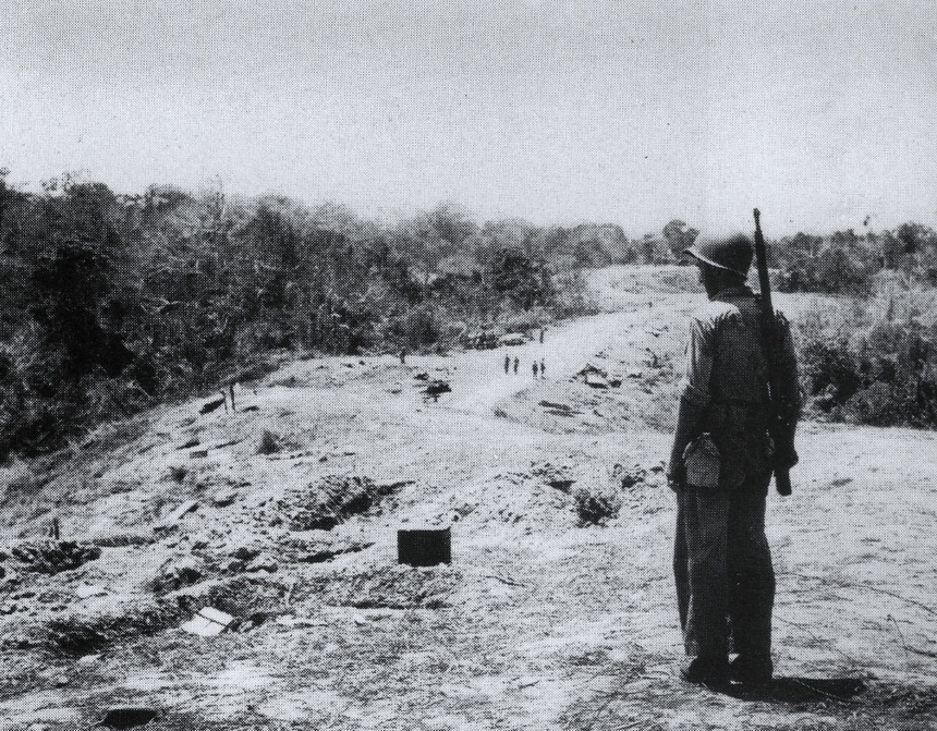 Black and white picture of World War II soldiers positioned on the Bloody Ridge