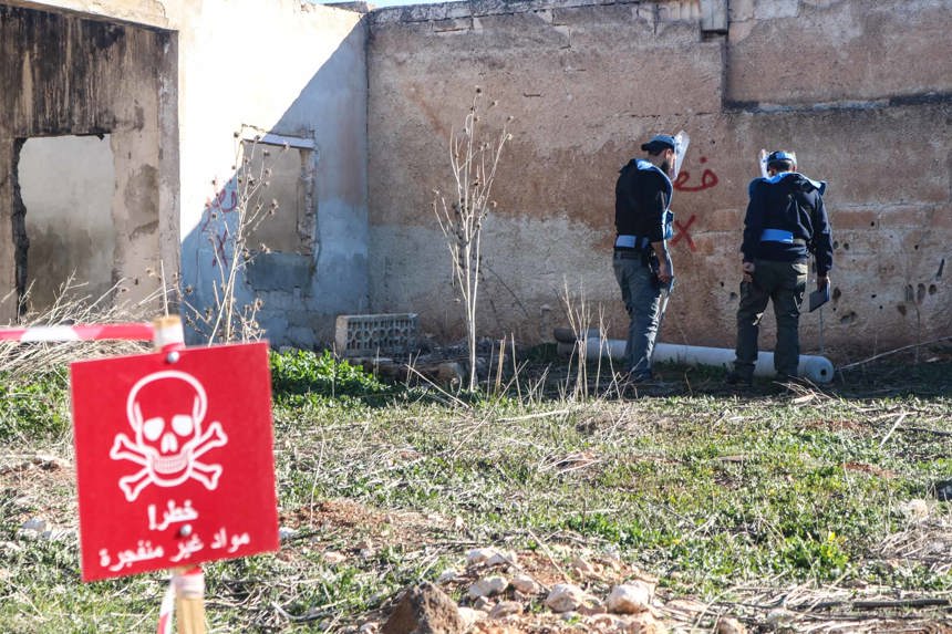 HALO's explosive ordinance team check a 220mm urgan thermobaric rocket in Luf village