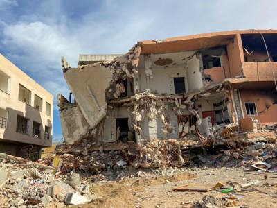 Destroyed buildings with rubble around them in Tripoli
