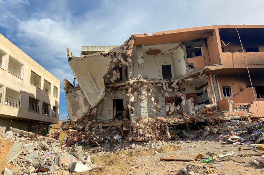 Destroyed buildings with rubble around them in Tripoli