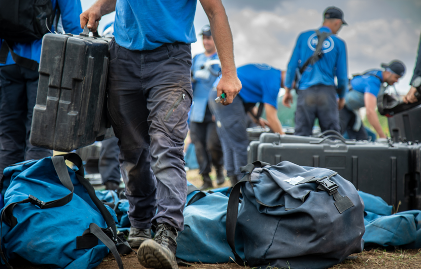 HALO'S Ukraine staff members picking up bags outside