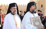 Clergy lead a solemn procession during the epiphany service at the Baptism site, dressed in traditional robes.