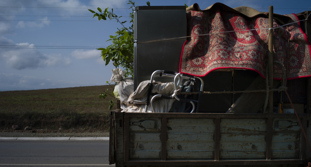 A family fleeing their home in Nagorno-Karabakh
