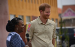 Prince Harry smiles during an interview on the street in Huambo, Angola