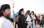 Clergy lead a solemn procession during the epiphany service at the Baptism site, dressed in traditional robes.