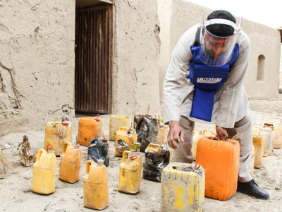 HALO staff picking up IEDs
