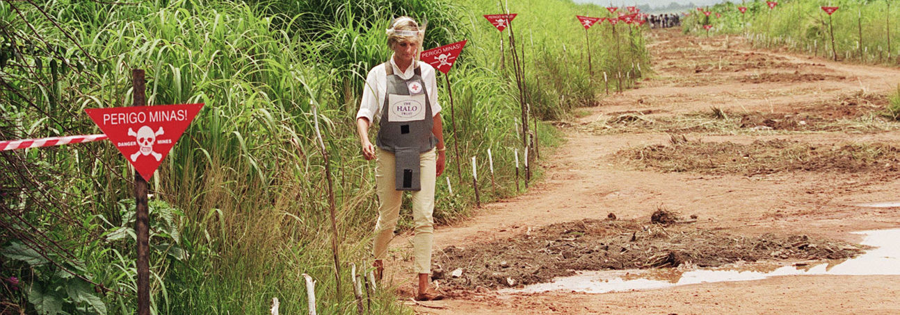 Princess Diana walking through a minefield in Angola in 1997