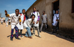 A group of teenagers posing for the camera in Huambo