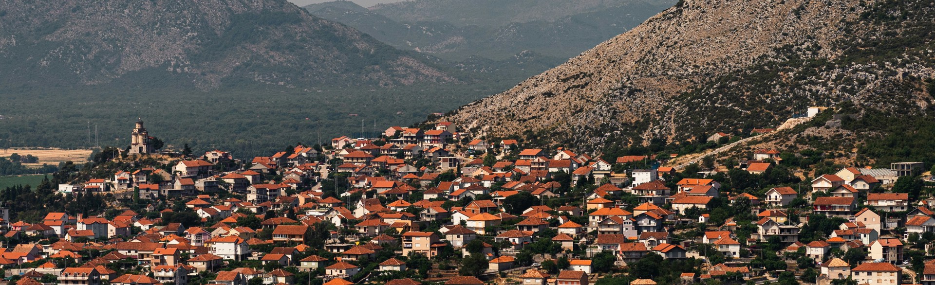 City in Bosnia and Herzegovina with mountains behind