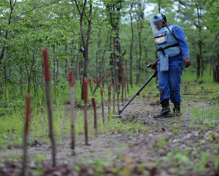 Female deminer working in Chisecha, Zimbabwe