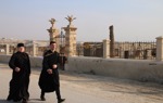 Pilgrims walk through the Baptism Site, formerly contaminated with explosives