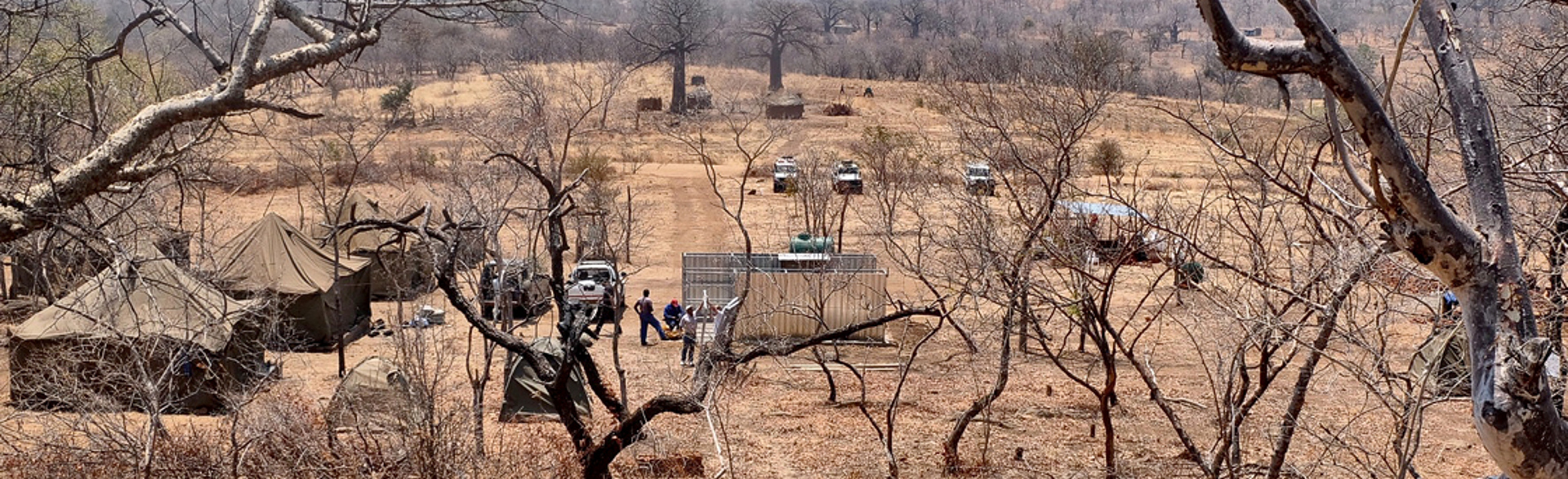 Solar powered camp with tents and vehicles in Zimbabwe