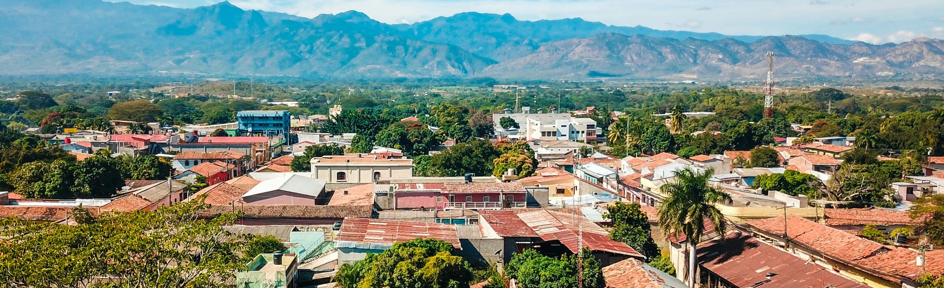View of a Honduran city with mountains in the background