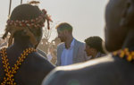 Prince Harry is greeted by local dancers during his visit to a HALO Trust site in Angola
