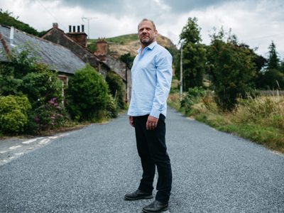 Simon Conway stands in the middle of a road