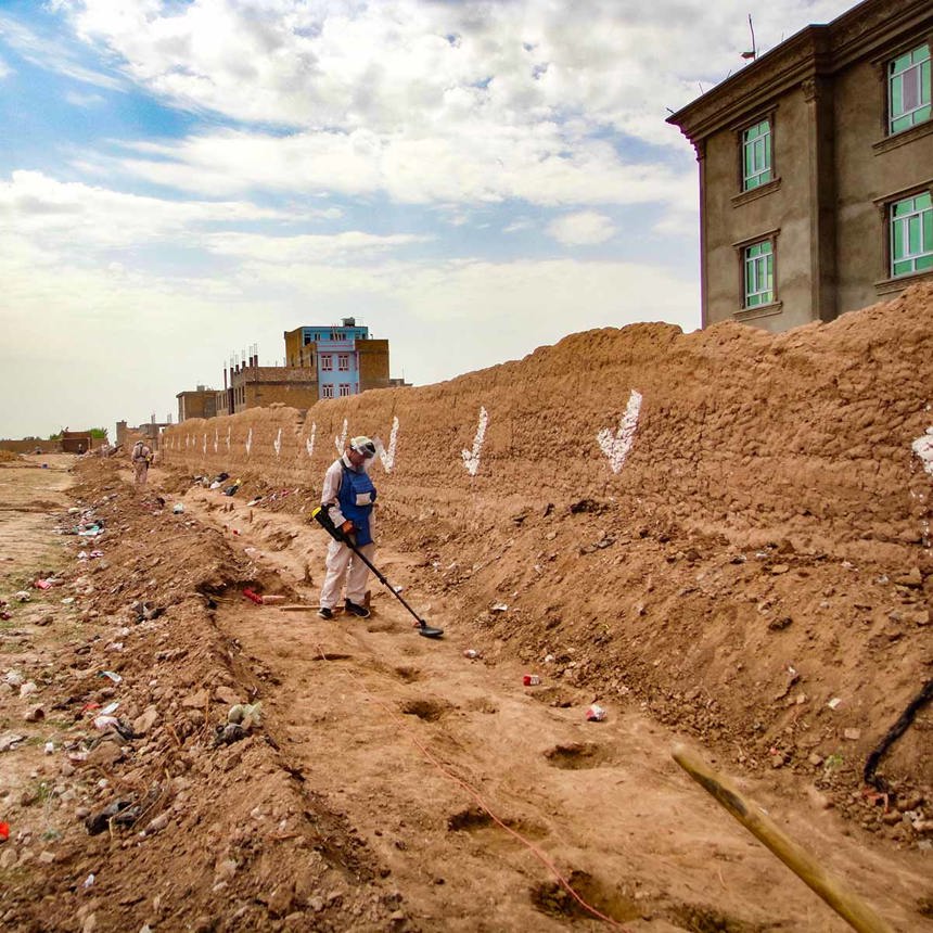 A HALO deminer uses a detector on a contaminated site in Afghanistan