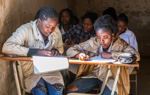 Students working in a classroom in Princess Diana School, Huambo