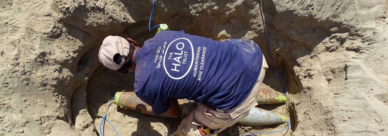 A HALO deminer prepares a hole filled with rockets for demolition in the frontline city of Taiz, Yemen