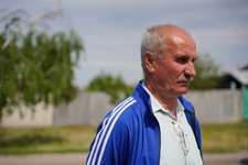 A man in a residential area looks ahead