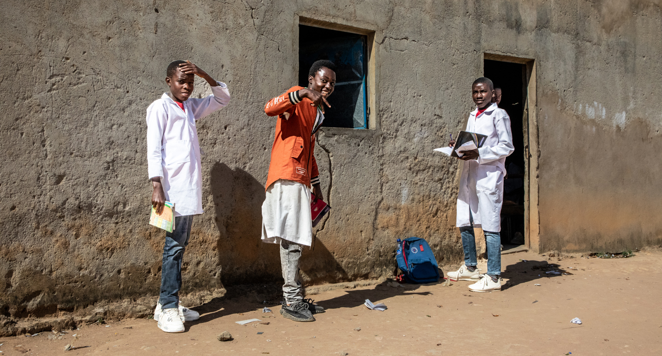 A group of smiling young men at Princess Diana School in Huambo 