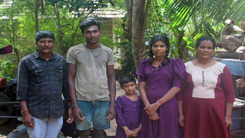 Maheshwary and her family stand outside their home in Kilinochchi, northern province