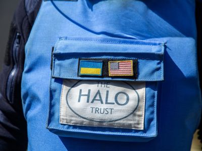 A close up of the HALO trust badge and US flag on a HALO protective vest