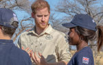 Prince Harry talks with HALO Trust deminer, Elisa, in a minefield in Angola
