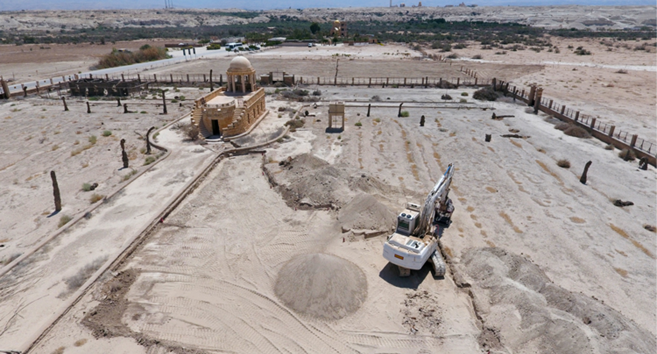 A digger clears explosives outside of the historic Franciscan Church 