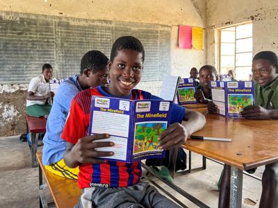 Children in a classroom receive an Explosive Ordnance Risk Education session in Zimbabwe