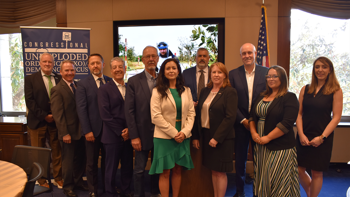 Group of people at a UXO caucus event