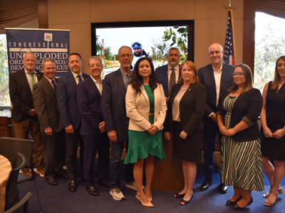 Group of people at a UXO caucus event