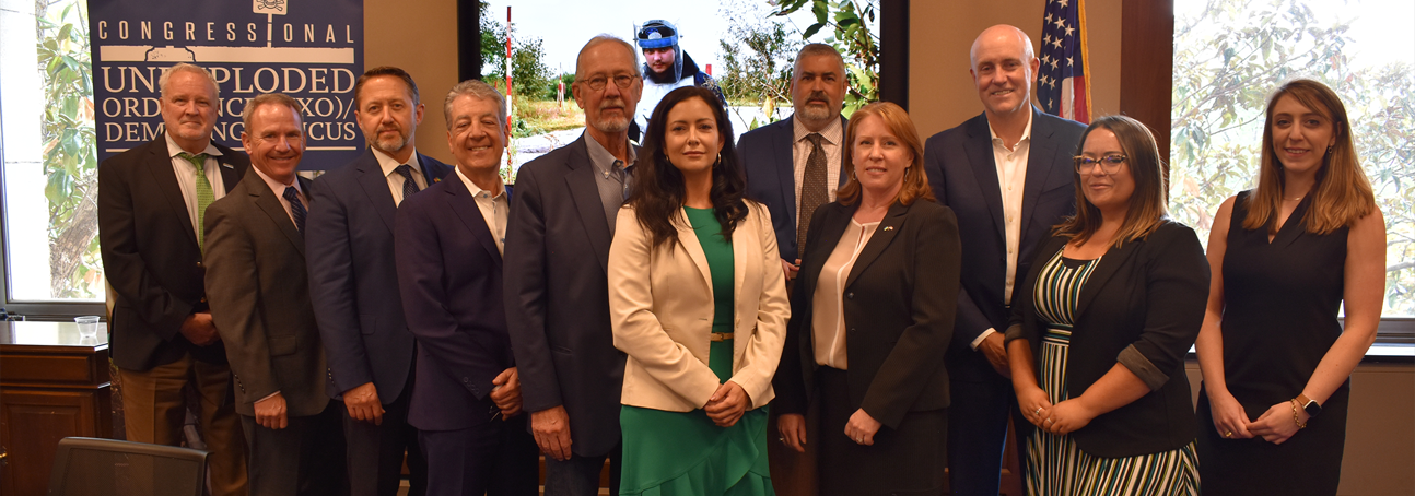 Group of people at a UXO caucus event